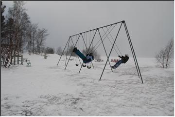 Swinging in the wind.