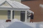 Roof rake in use